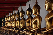 Bangkok Wat Pho, Buddha gilded statues lined in the double cloister enclosing the ubosot. 